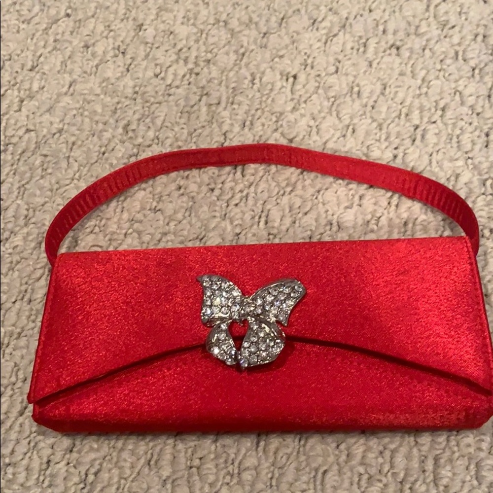 Red evening bag with rhinestone bow